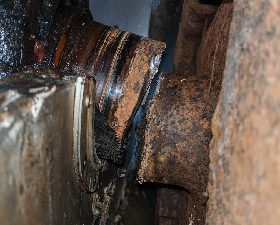 Upper Crispbrook Mill water wheel shaft fracture — corrosion-assisted fatigue origin near mounting block and engineered stainless stub shaft/flange repair concept